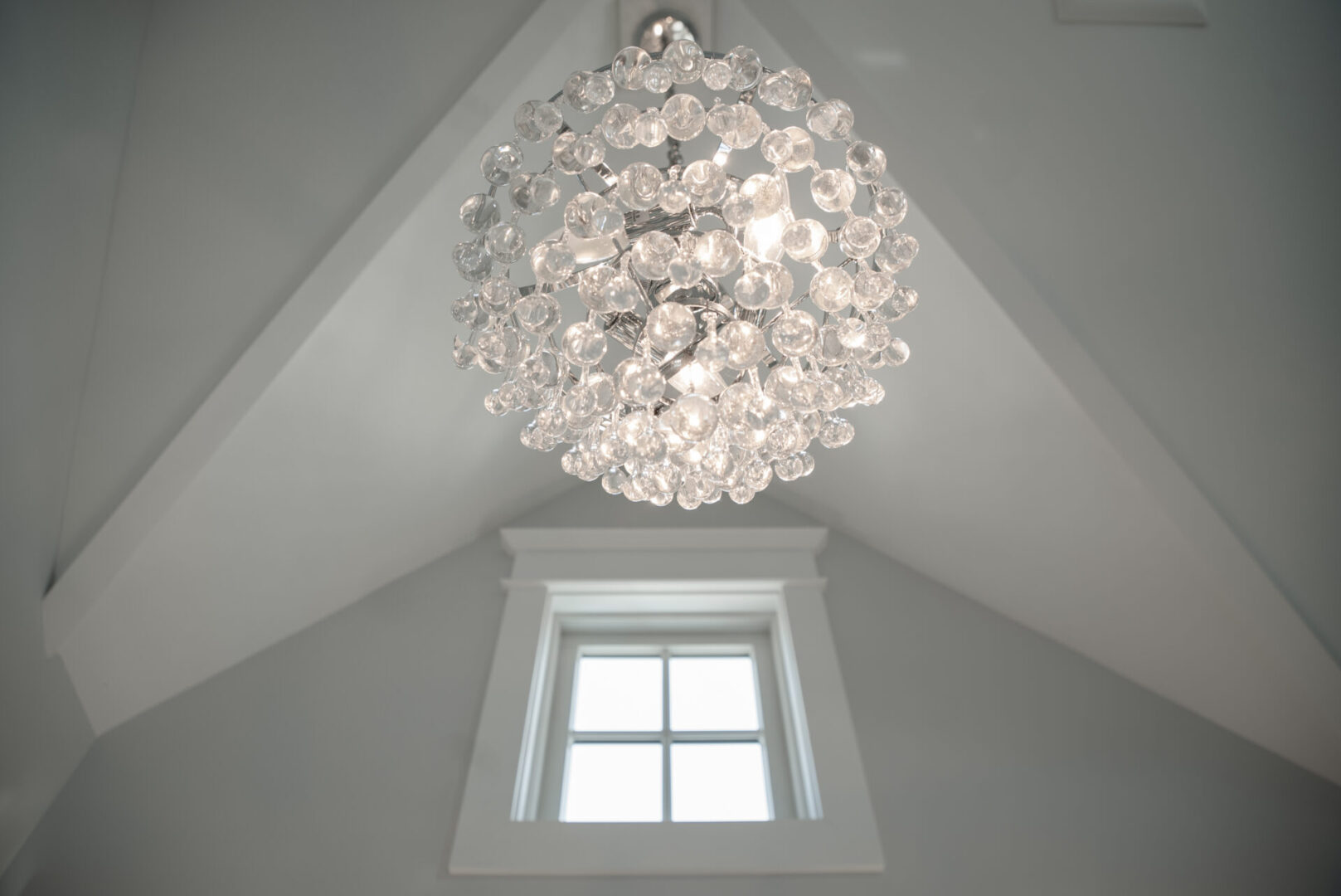 A hanging light with crystal designs