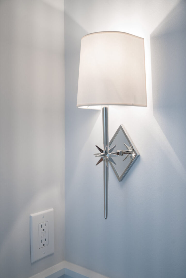 A wall lamp next to a socket