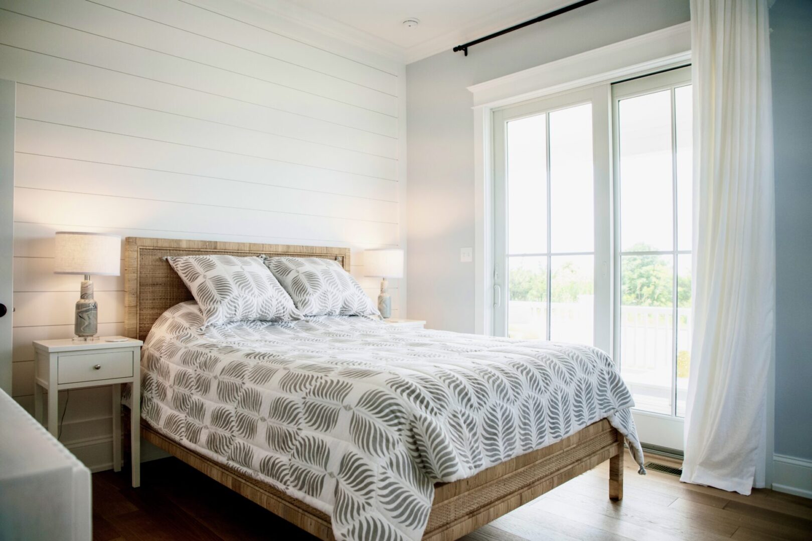 A large bed in a white bedroom